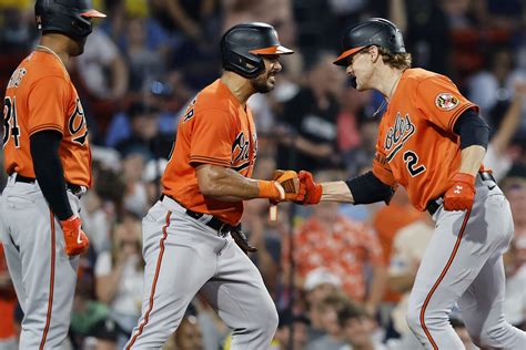 Orioles hang on to beat Red Sox 13-12 for 7th straight win as McCann homers twice
